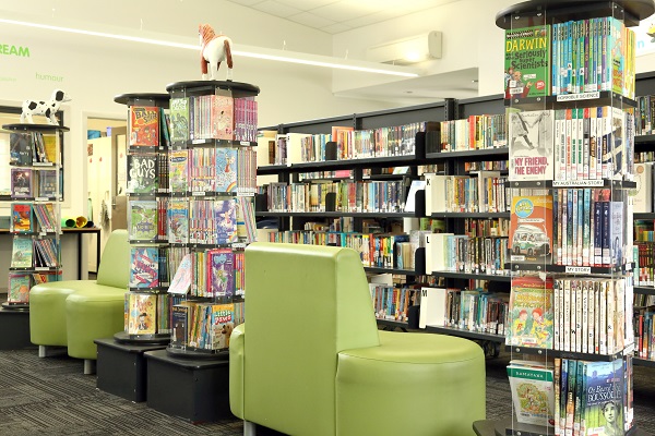 School library interior with book shelves and seating.